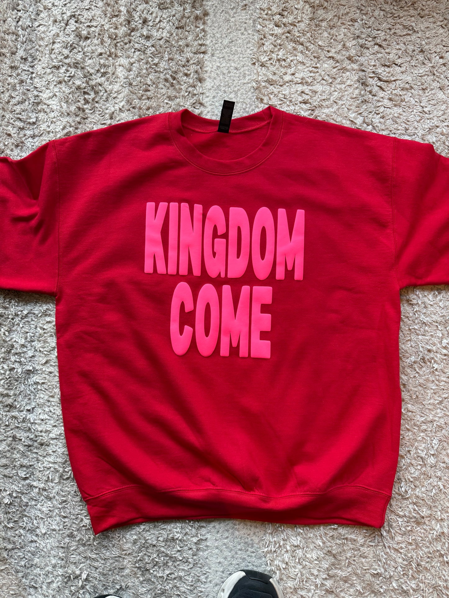Neon pink on red crewneck